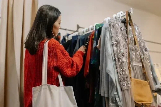 Woman browsing clothing rack