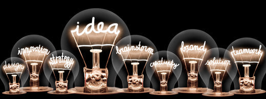 Lightbulbs with words written inside