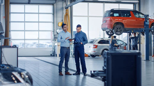 Two men at car dealership