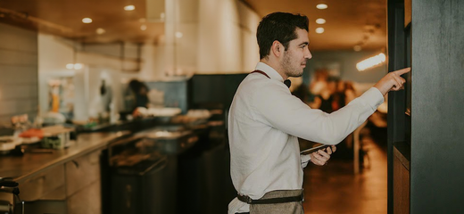 Wait staff placing an order on a Tablet Kiosk