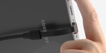 Person connecting Armodilo USB-C right angle cable to a Samsung tablet, showcasing ergonomic design for optimal fit.