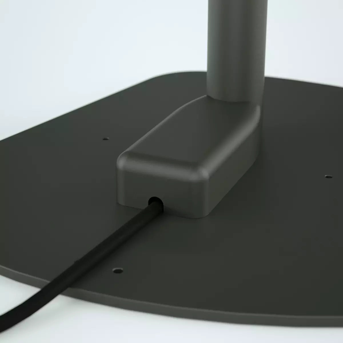 Close up of the black kiosk stand baseplate with the electrical cover hiding wiring..