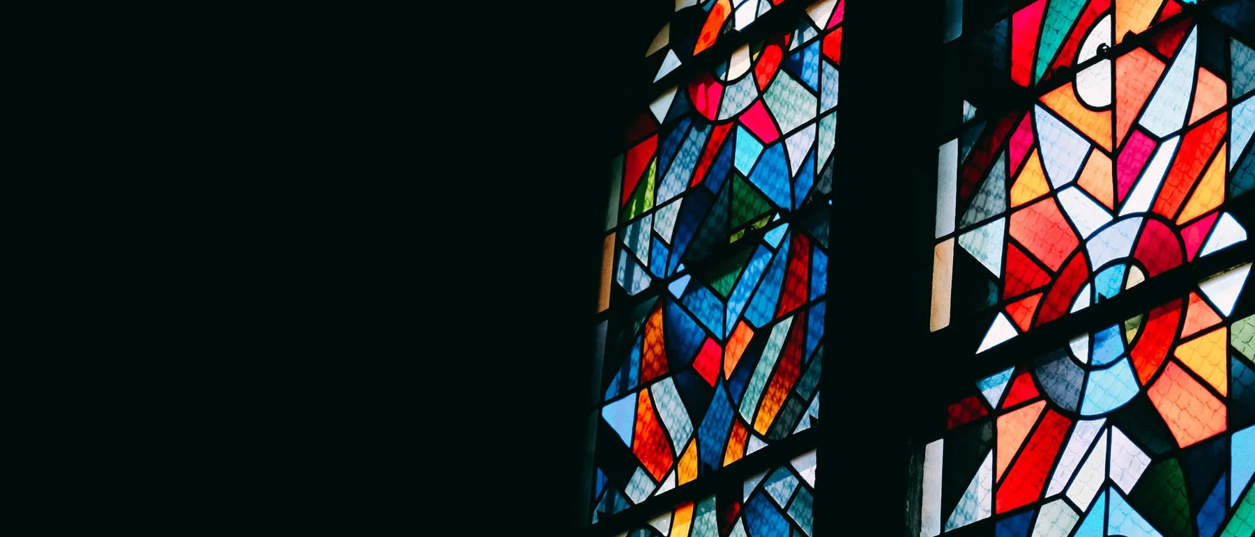 Detail of stained glass window panes in a place of worship